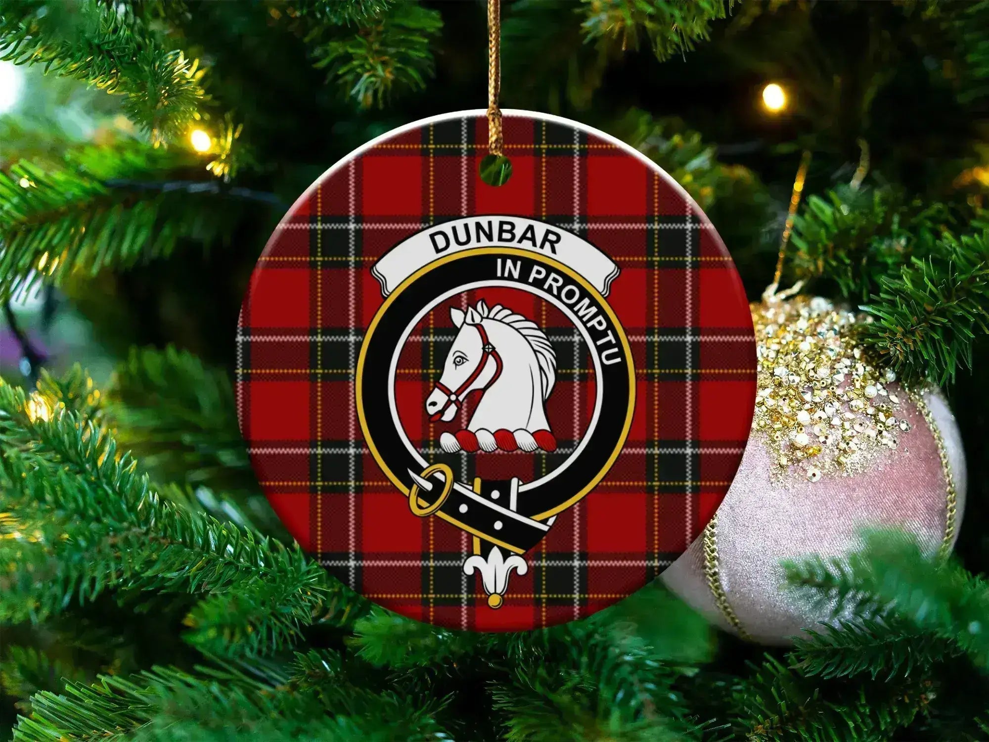 Clan Dunbar round ceramic ornament — front view showing crest and tartan with gold hanging string
