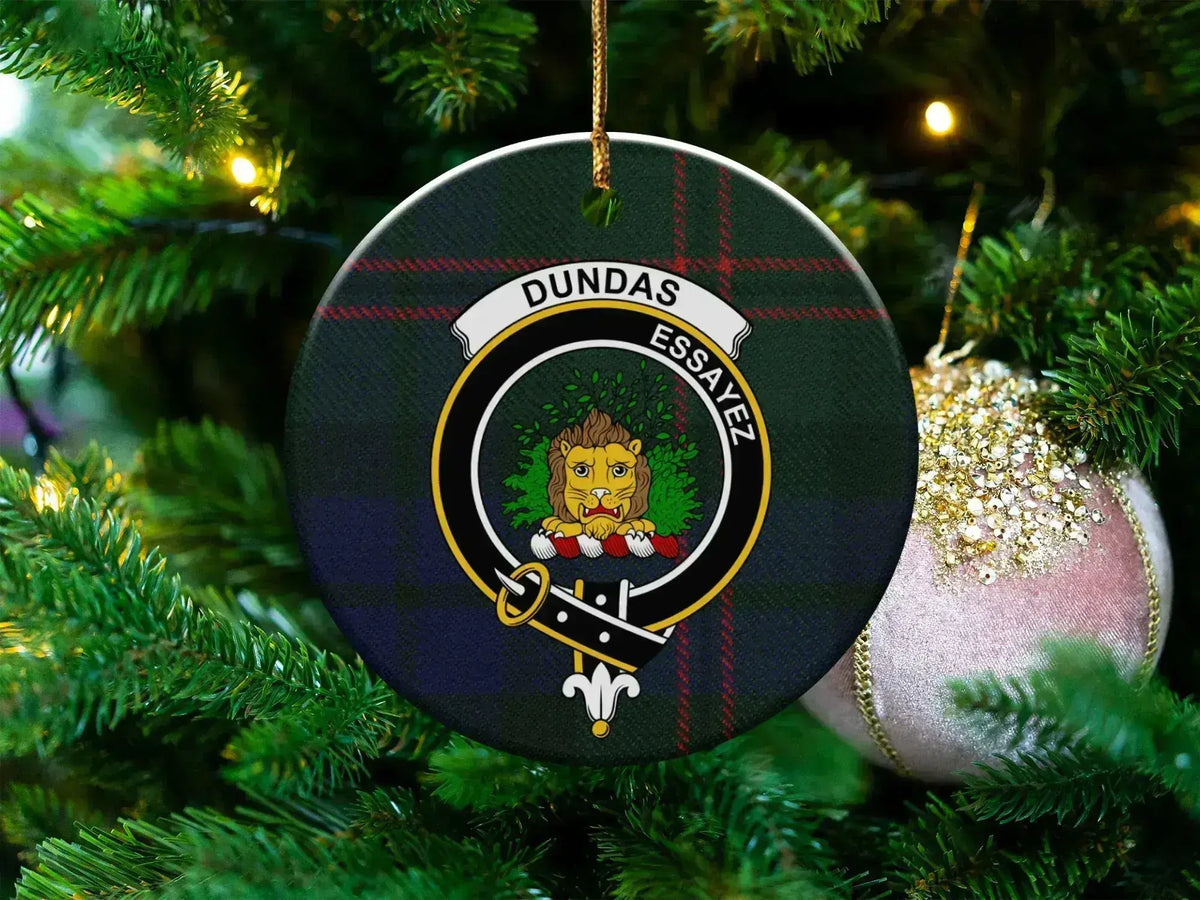 Clan Dundas round ceramic ornament — front view showing lion crest and tartan with gold hanging string
