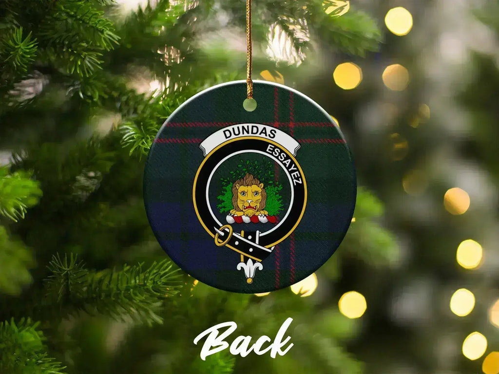 Clan Dundas Christmas ornament close-up — round ceramic, lion crest on tartan background