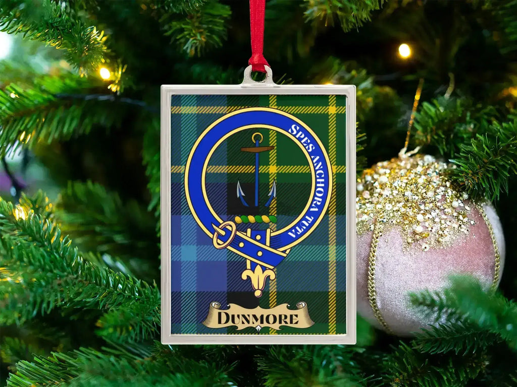 Dunmore clan crest Christmas ornament in a silver frame on a tartan background