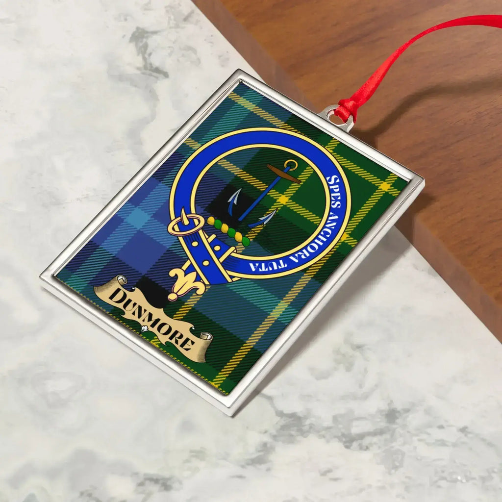 Dunmore ornament hanging from a Christmas tree branch by its satin ribbon