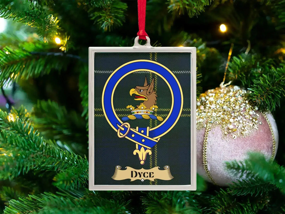Dyce clan crest Christmas ornament in a silver frame on a tartan background