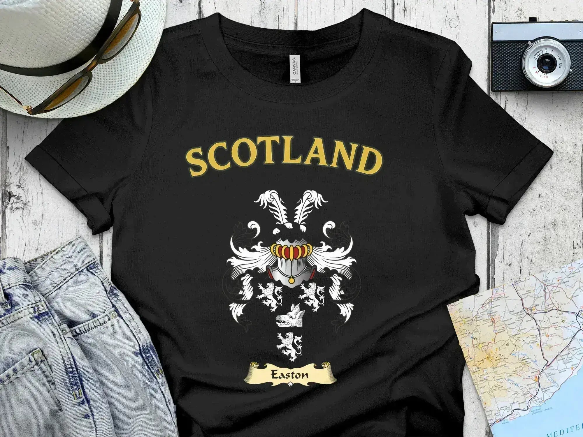 Easton Scottish clan crest t-shirt — front view of the printed crest on a tartan background