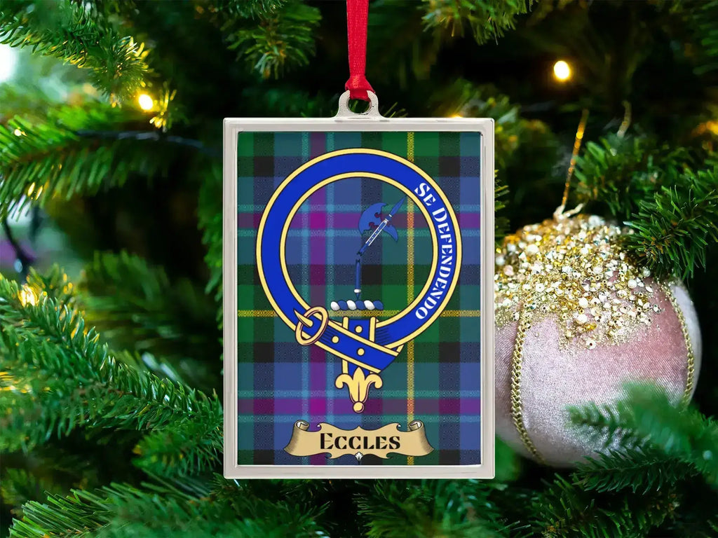 Eccles clan crest Christmas ornament in a silver frame on a tartan background