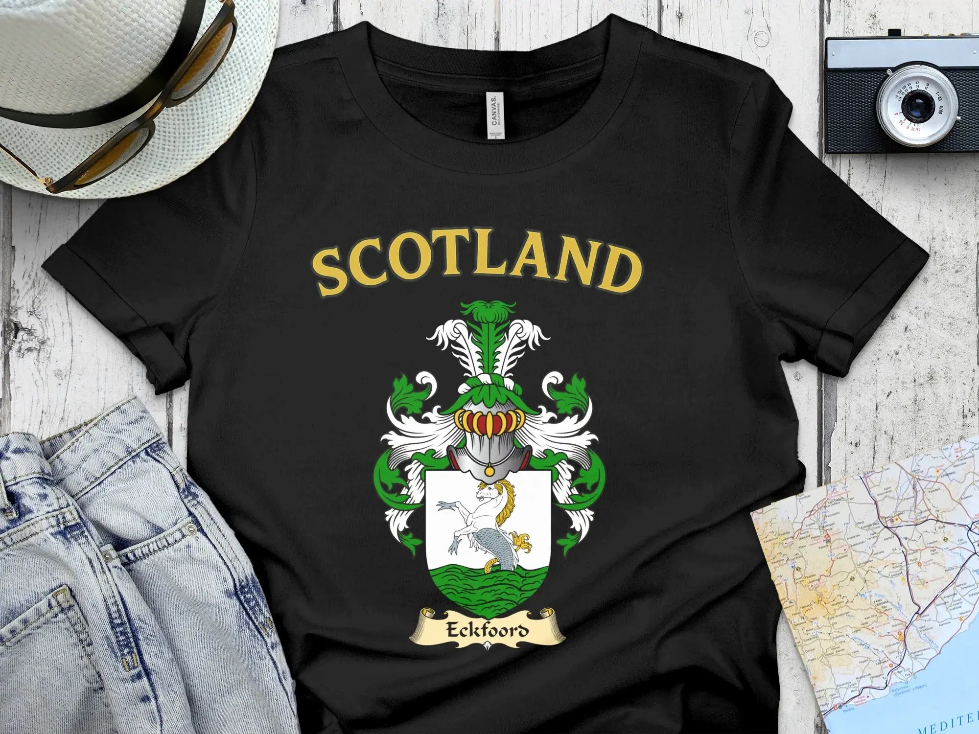 Eckfoord Scottish clan crest t-shirt — front view of the printed crest on a tartan background