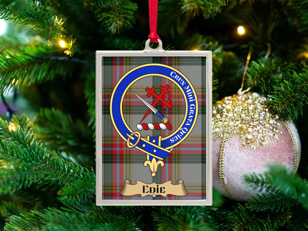 Edie clan crest Christmas ornament in a silver frame on a tartan background