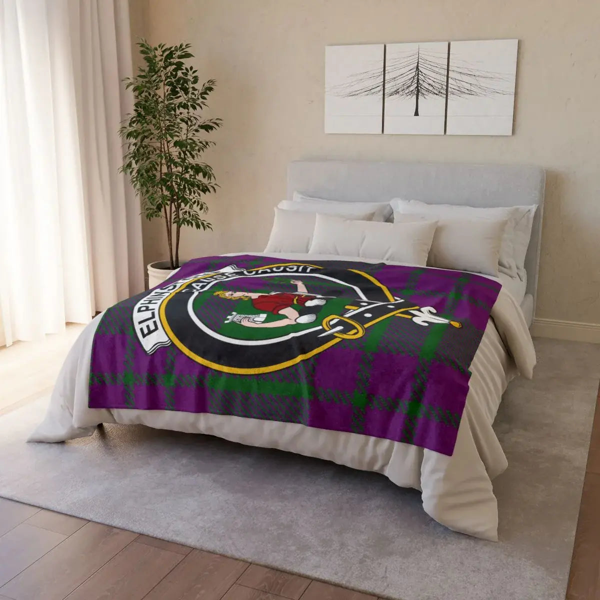 Elphinstone clan crest throw blanket draped over sofa — full-colour tartan print, white reverse