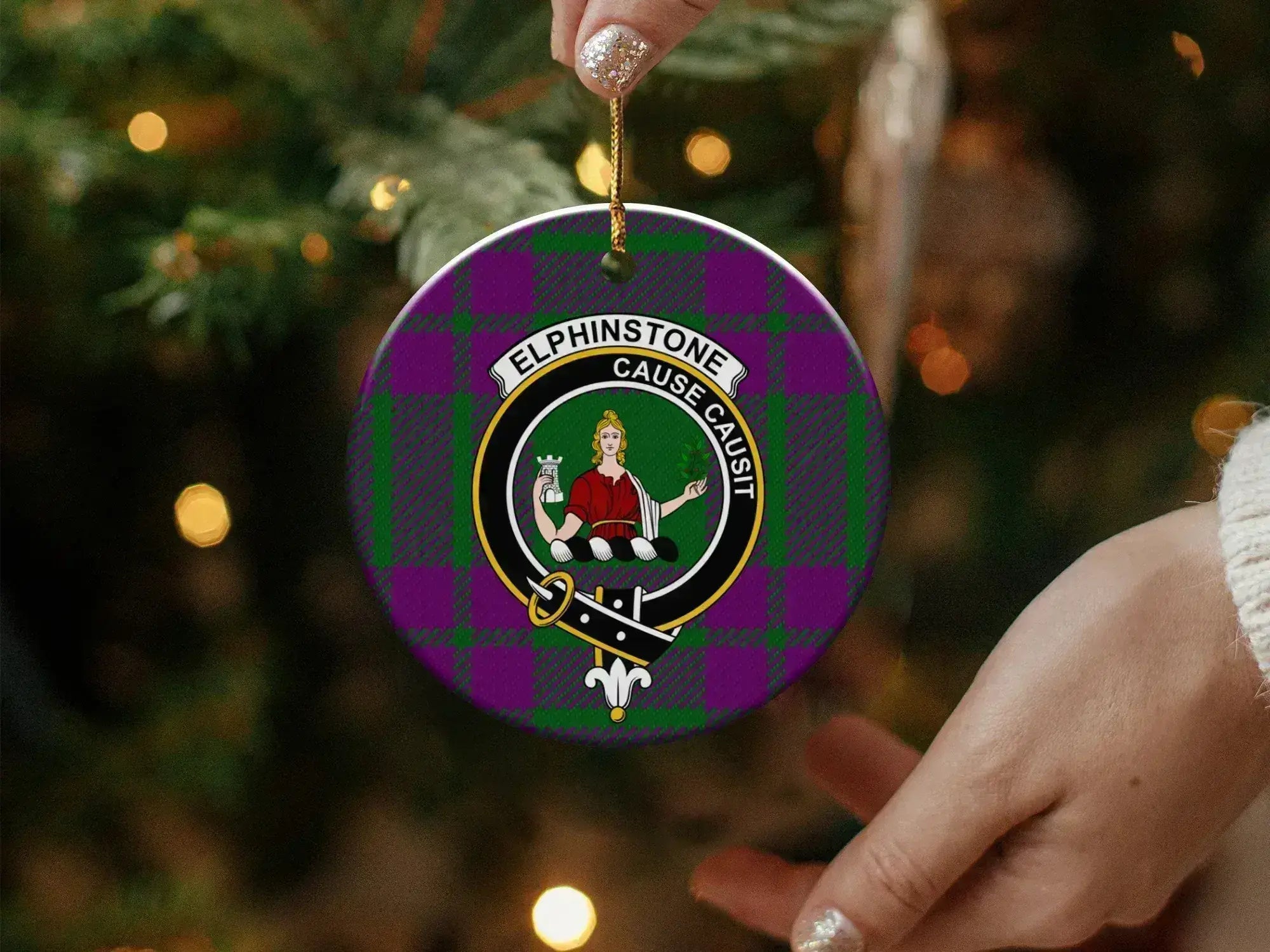Elphinstone clan ornament angled view — 3 inch round ceramic, gold string, crest on tartan background