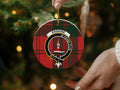 Erskine clan ornament angled view — 3 inch round ceramic, gold string, crest on tartan background