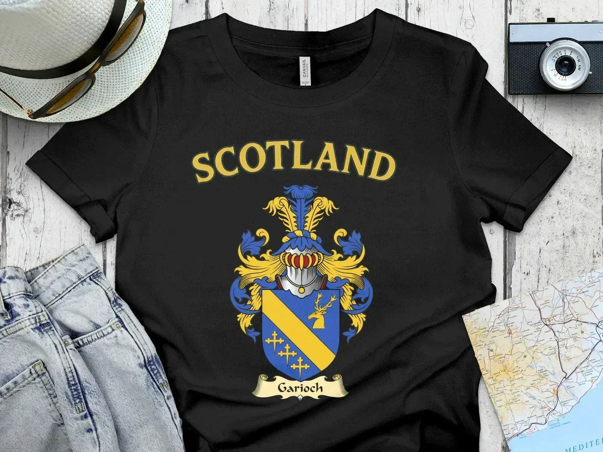 Garioch Scottish clan crest t-shirt — front view of the printed crest on a tartan background