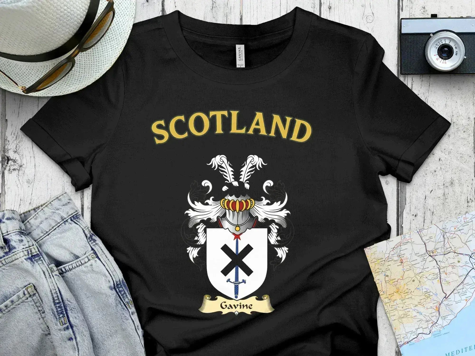 Gavine Scottish clan crest t-shirt — front view of the printed crest on a tartan background