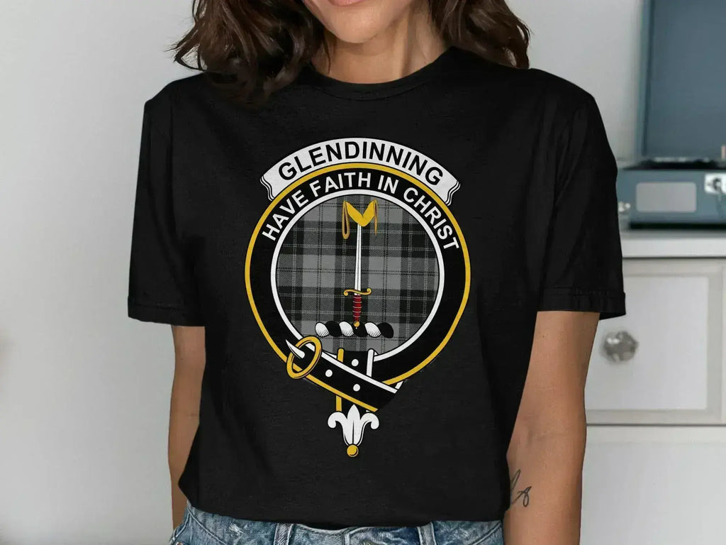 Glendinning clan crest t-shirt in royal blue — close-up of crest and tartan on chest