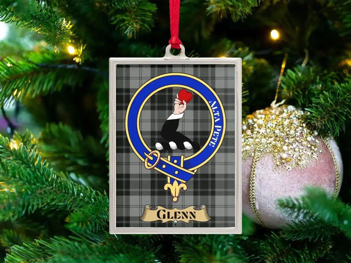 Glenn clan crest Christmas ornament in a silver frame on a tartan background
