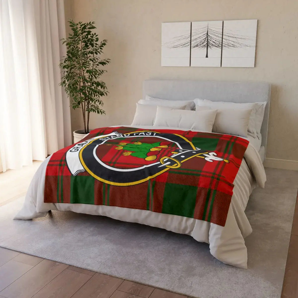 Grant clan tartan throw blanket on bed — lightweight polyester, cosy red-green plaid