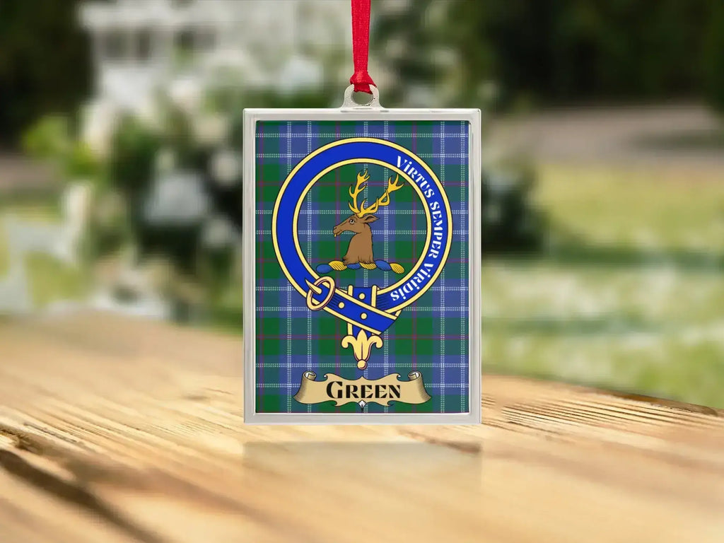 Close-up of the Green family crest on a polished silver-frame metal ornament