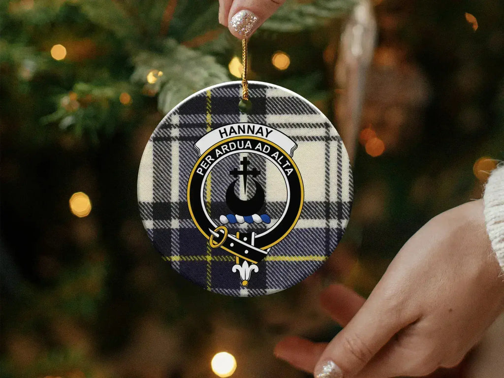 Hannay tartan crest ornament — 3 inch round ceramic shown from angle with gold string