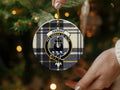 Hannay tartan crest ornament — 3 inch round ceramic shown from angle with gold string