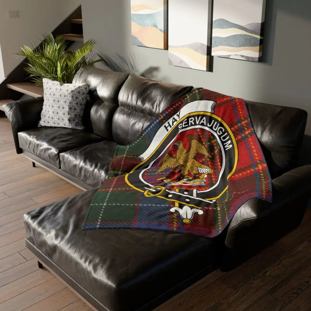 Hay clan crest tartan throw blanket on sofa — 50x60 polyester, Serva Jugum eagle heraldic design
