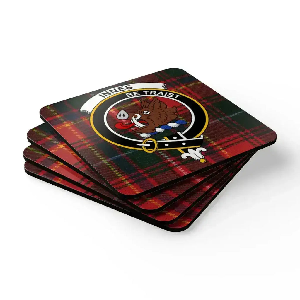 Innes clan tartan coaster set — four natural cork squares with boar's head heraldic design