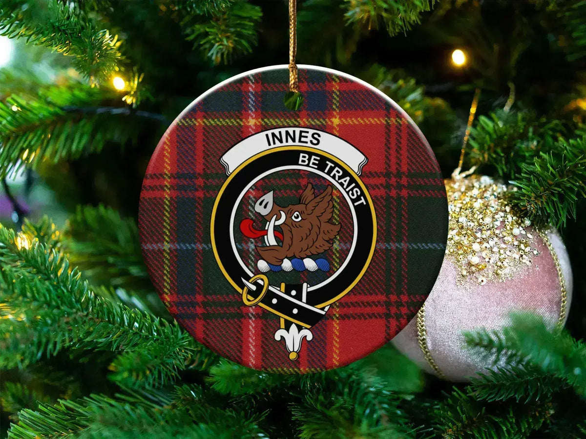 Innes clan tartan ceramic ornament — 3-inch round glossy disc with boar's head crest and Be Traist motto