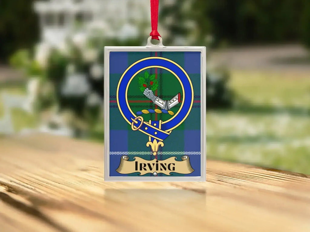 Close-up of the Irving family crest on a polished silver-frame metal ornament