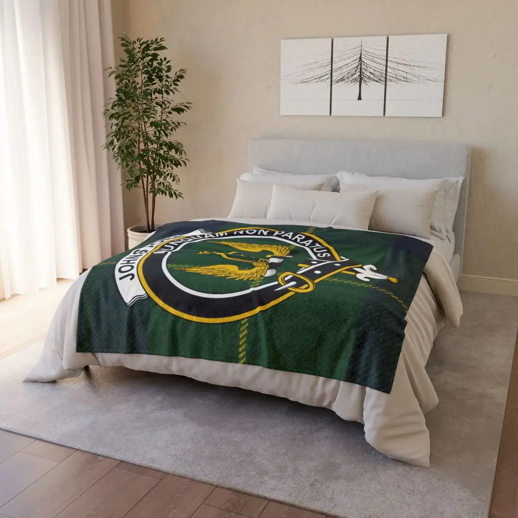 Johnstone clan crest throw blanket on sofa — lightweight 100% polyester with clan heraldic design