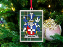 Keenan Irish family crest Christmas ornament — crest on the Irish national tartan in a silver-tone frame