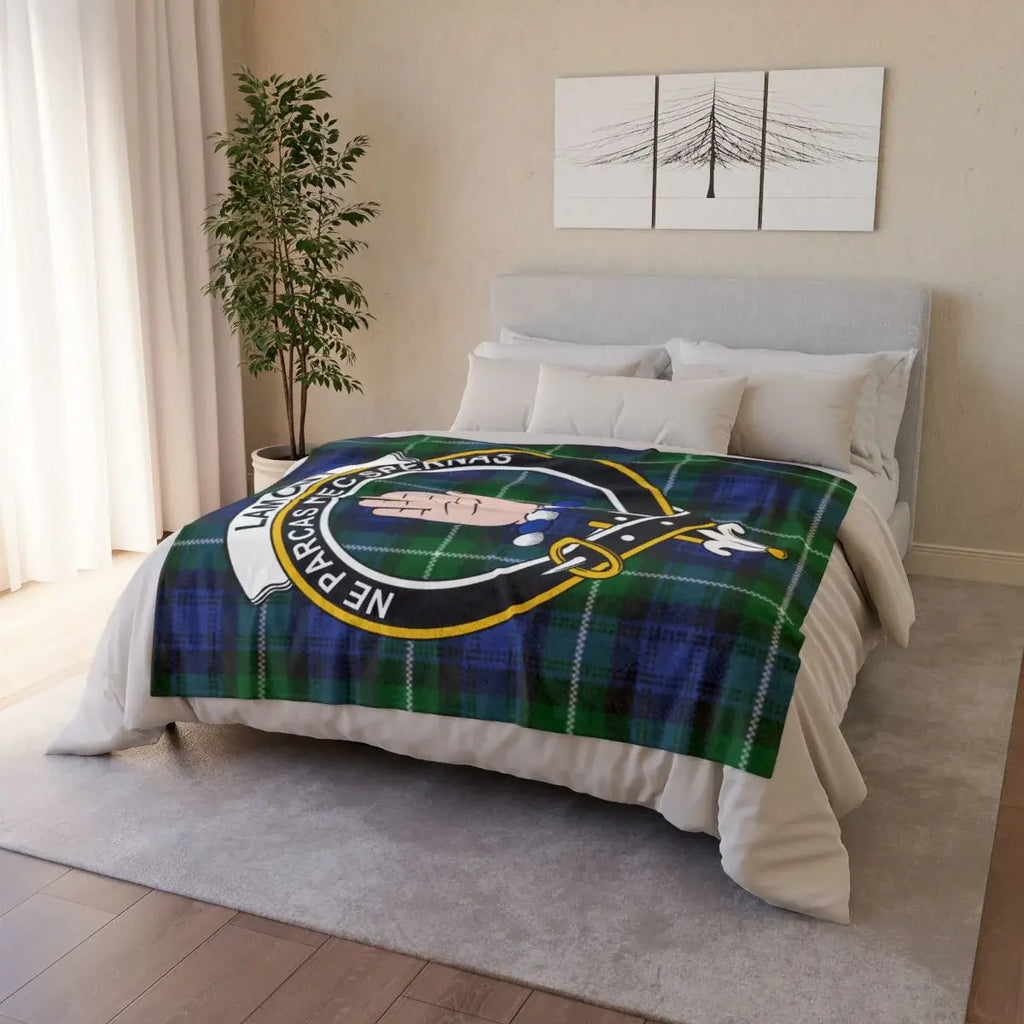Lamont clan crest throw blanket on sofa — lightweight 100% polyester with clan heraldic design