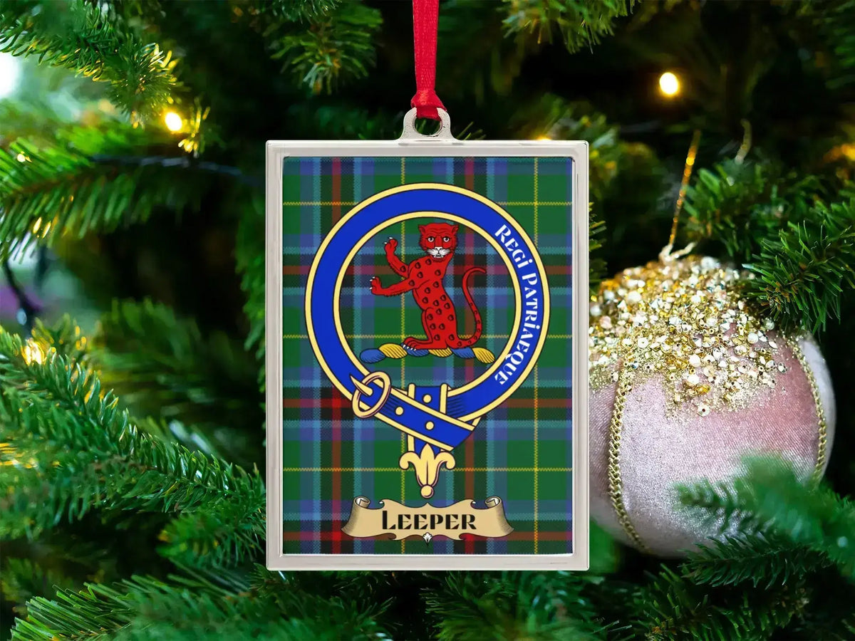 Leeper clan crest Christmas ornament in a silver frame on a tartan background