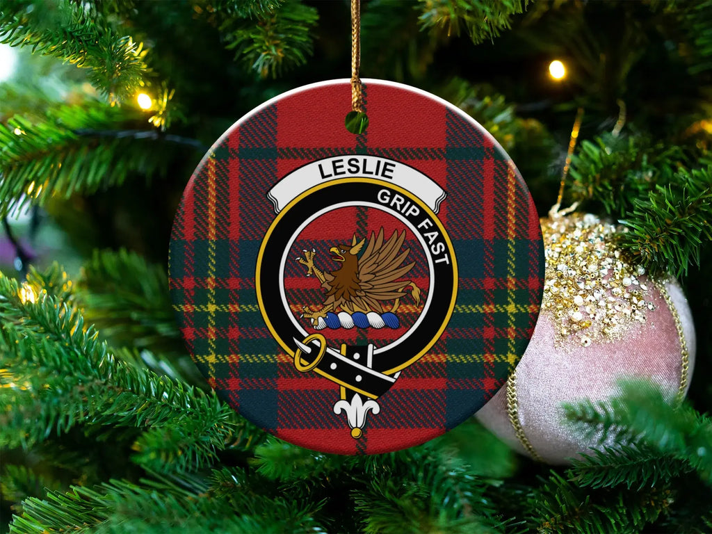 Leslie clan tartan ceramic ornament — 3-inch round glossy disc with griffin crest and Grip Fast motto