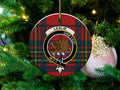 Leslie clan tartan ceramic ornament — 3-inch round glossy disc with griffin crest and Grip Fast motto