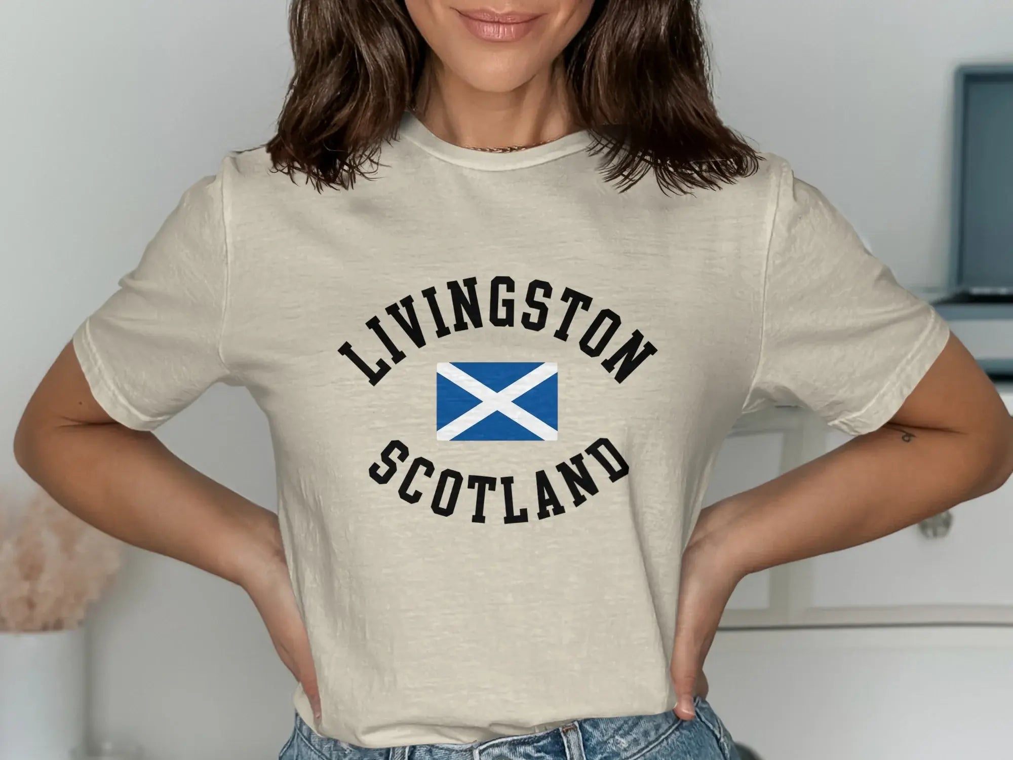 Livingston Scotland flag graphic tee — sand colourway showing heritage design, relaxed unisex fit