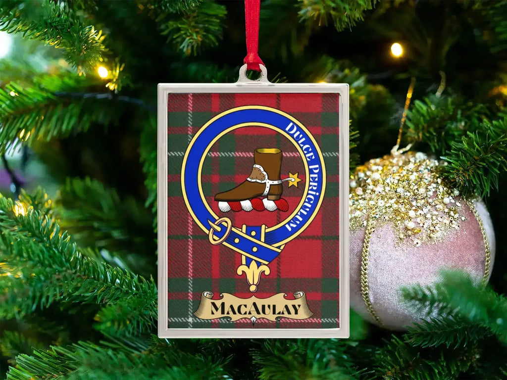 MacAulay clan crest Christmas ornament in a silver frame on a tartan background