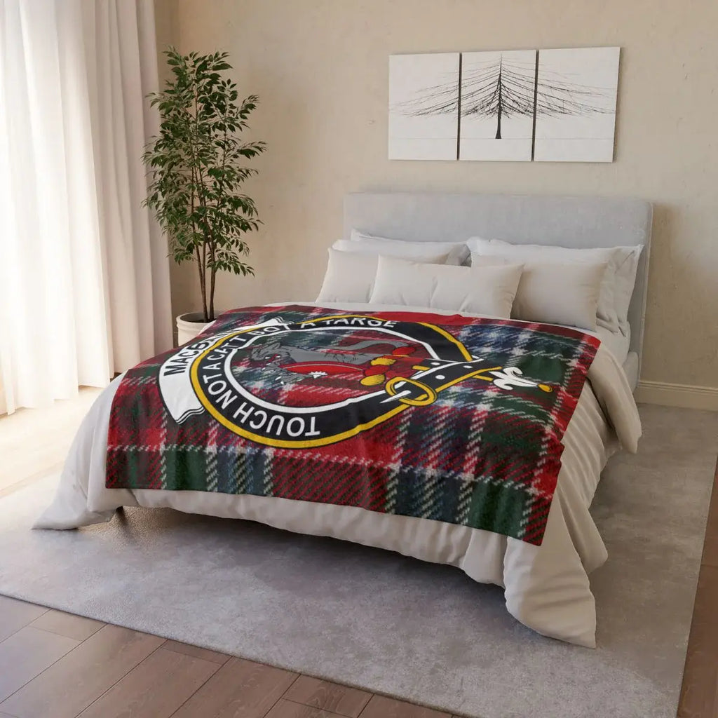 Clan MacBain crest throw — draped view showing tartan and clan crest print, hemmed edges