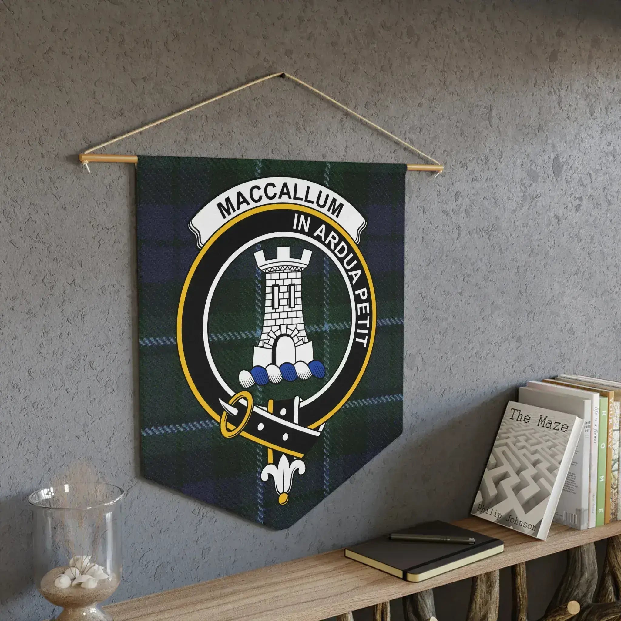 MacCallum In Ardua Petit pennant displayed on wall — Scottish clan tartan print detail