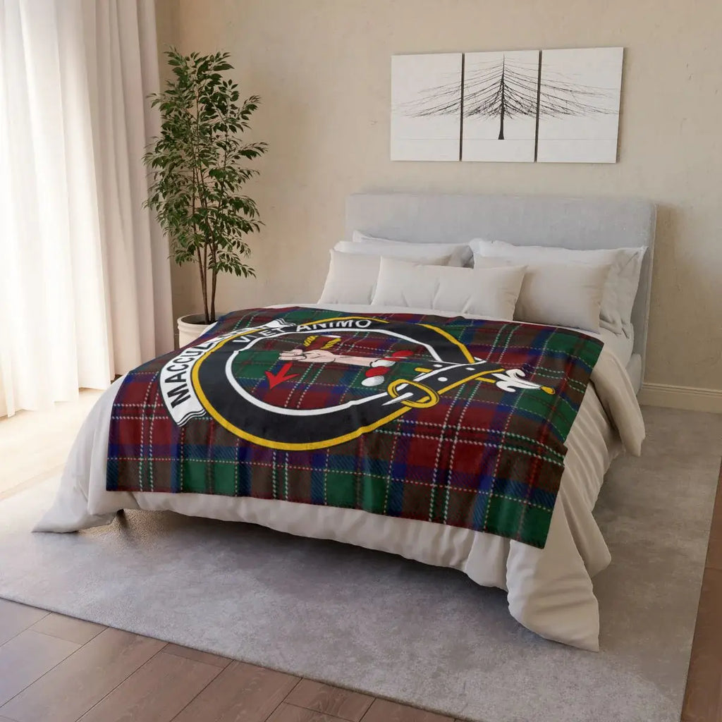 MacCulloch tartan crest throw draped over sofa — lightweight Scottish clan blanket in use
