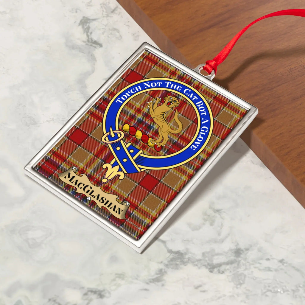 MacGlashan ornament hanging from a Christmas tree branch by its satin ribbon
