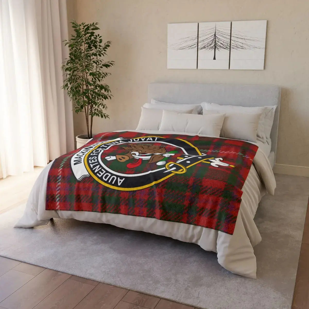 MacKinnon tartan crest throw draped over sofa — lightweight Scottish clan blanket in use