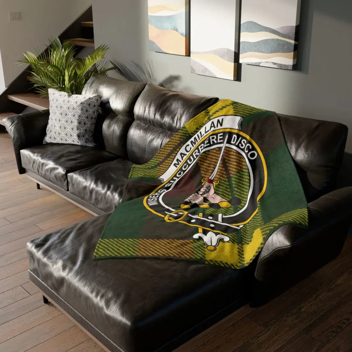 Clan MacMillan crest tartan printed throw blanket — green and yellow clan colours on sofa