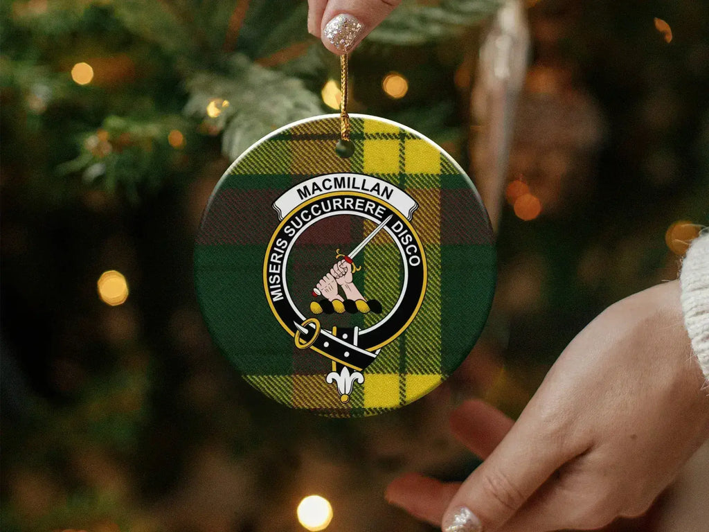 MacMillan family crest round ceramic ornament displayed on tree branch — Scottish heritage keepsake