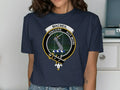 MacNeil clan crest t-shirt in black — front view showing Vincere Aut Mori tartan badge print