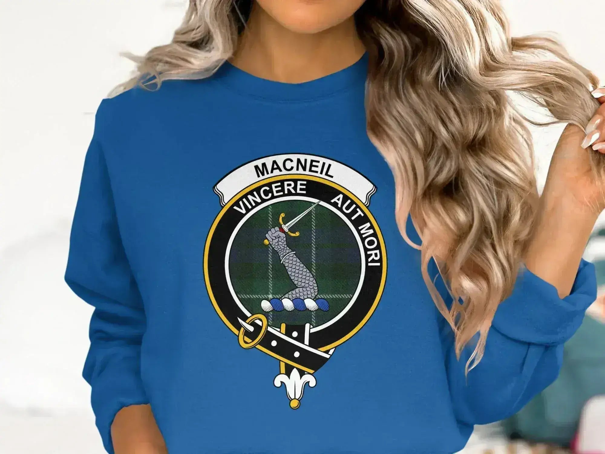 MacNeil tartan sweatshirt in royal blue — ribbed cuffs and waistband with printed clan crest