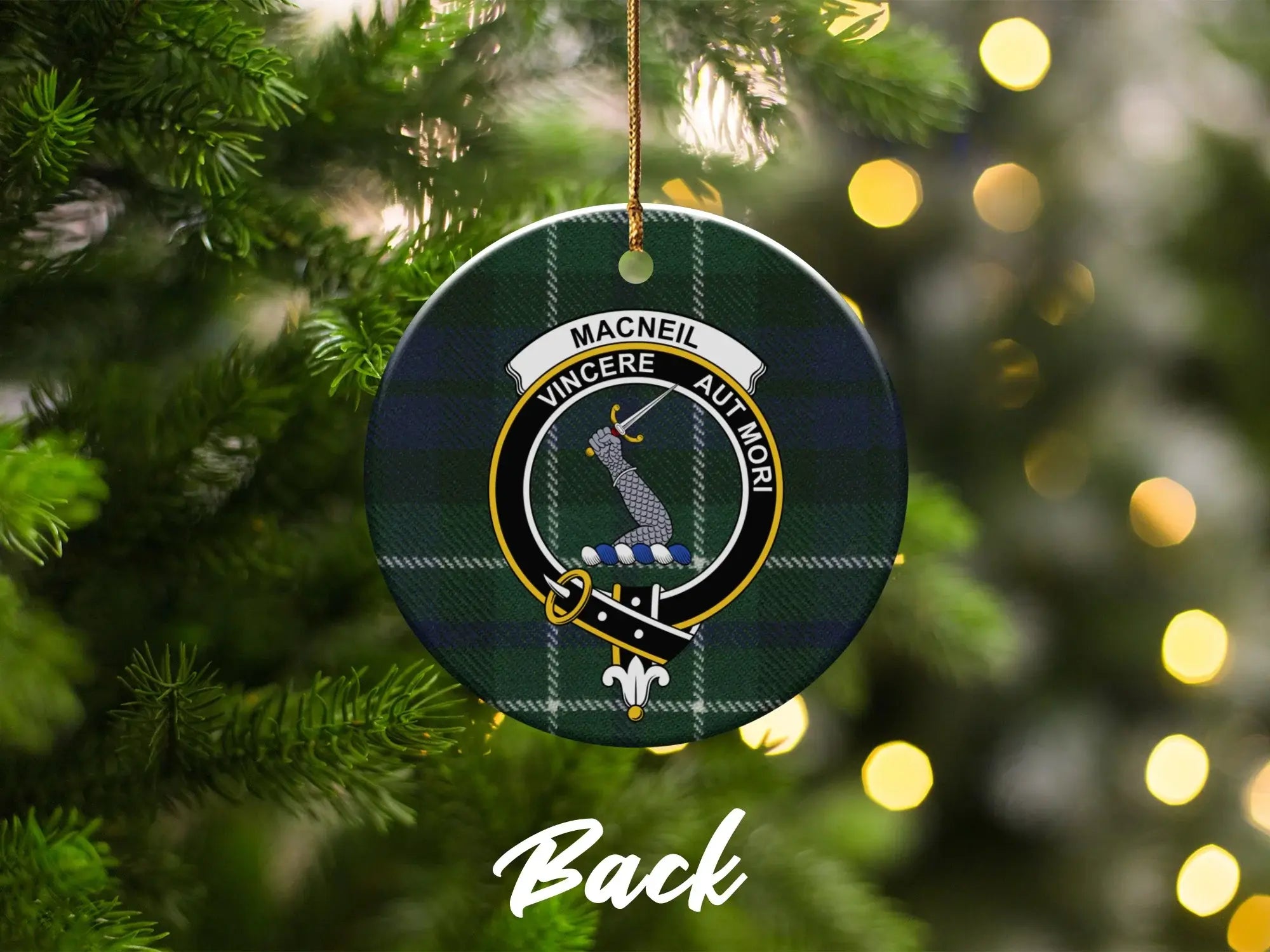 MacNeil family crest ceramic ornament on Christmas tree — Scottish clan tartan design