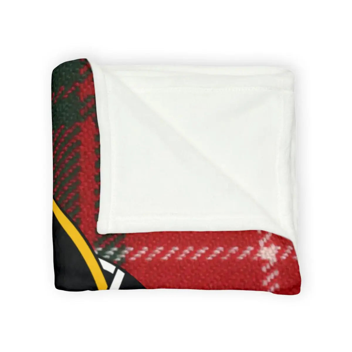 MacFie tartan throw draped over sofa arm — red and green plaid Pro Rege crest blanket