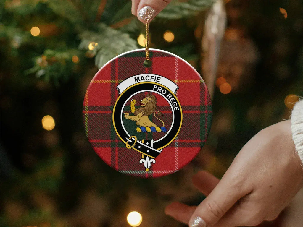 MacFie Pro Rege lion family crest ornament in hand — shows scale and double-sided print