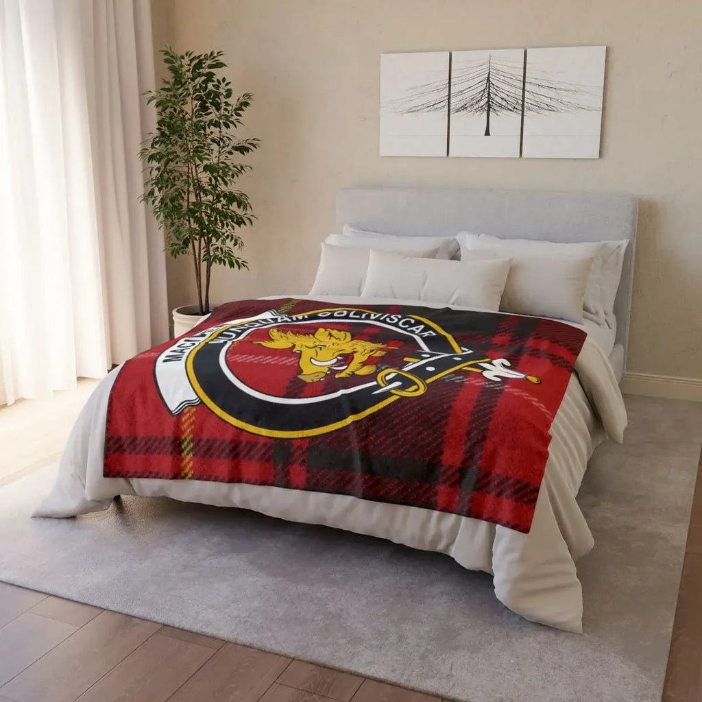 MacIver tartan crest throw draped over sofa — lightweight Scottish clan blanket in use
