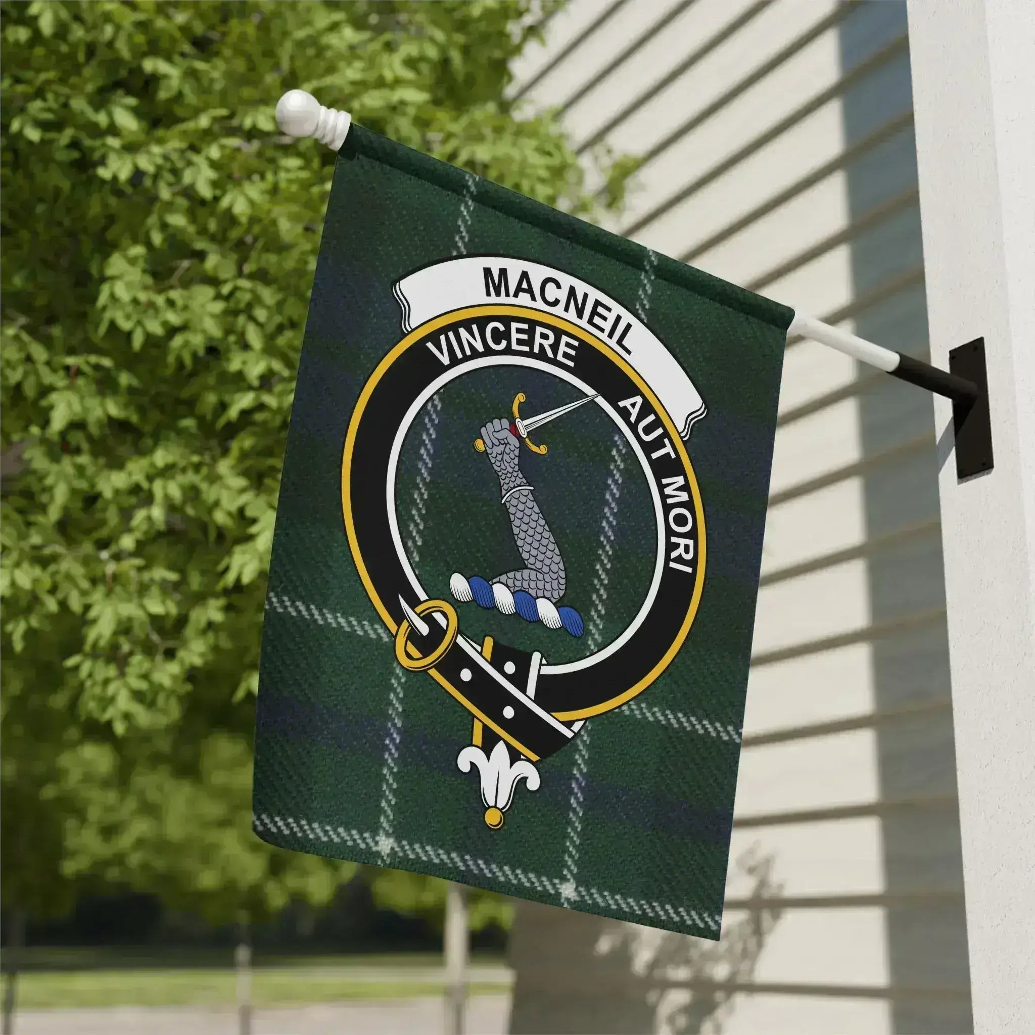 Clan MacNeil tartan garden flag displayed outdoors — 12x18 inch poly poplin-canvas with clan crest
