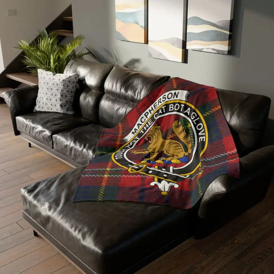 MacPherson clan badge with cat on tartan throw blanket