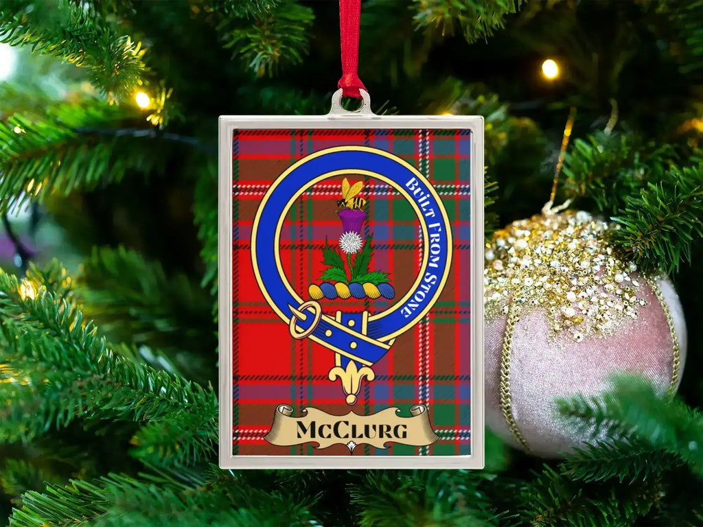 McClurg clan crest Christmas ornament in a silver frame on a tartan background
