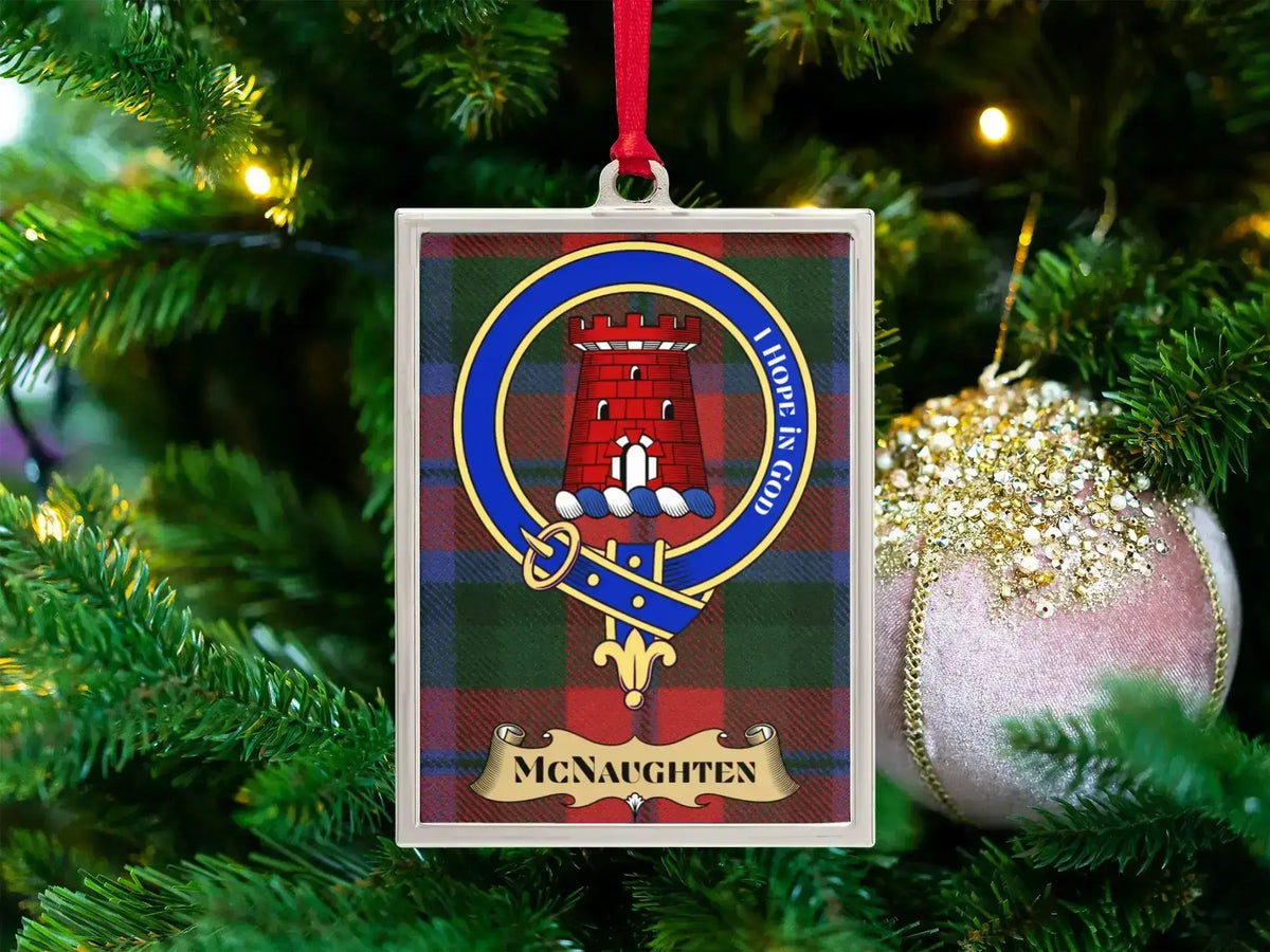McNaughten clan crest Christmas ornament in a silver frame on a tartan background
